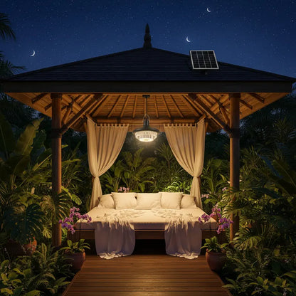 Wooden gazebo with a solar panel at night in a garden setting