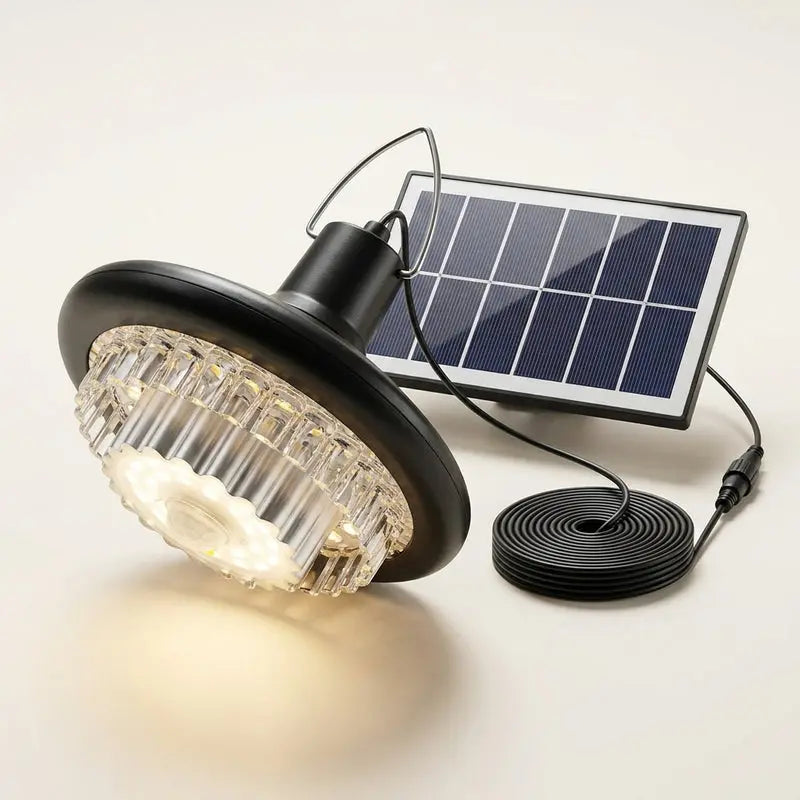 Solar-powered outdoor light with solar panel and cable on a white background