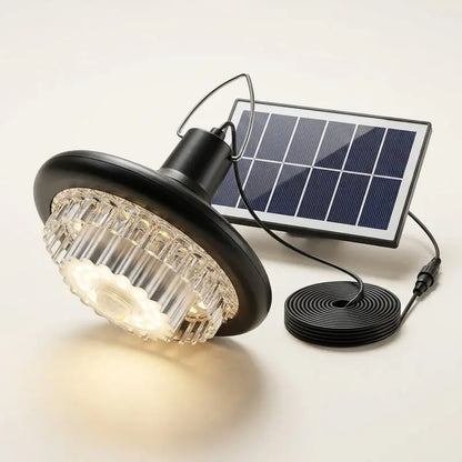 Solar-powered outdoor light with solar panel and cable on a white background