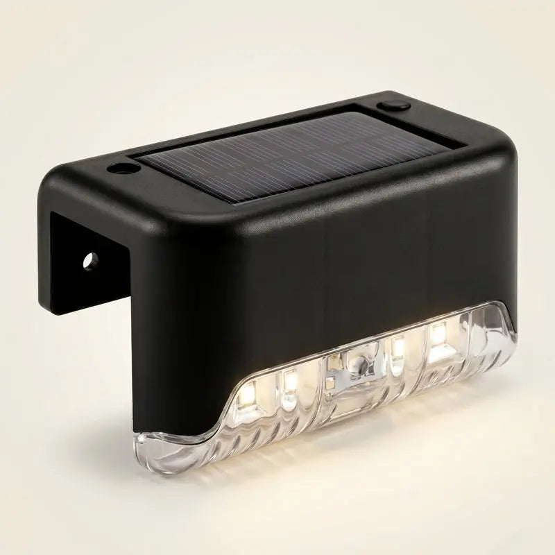 Black solar-powered outdoor light on a beige background