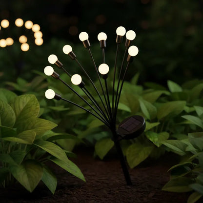 Solar garden light with multiple bulbs on a dark background