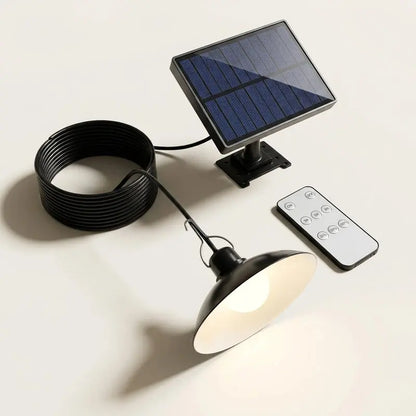 Solar-powered outdoor light fixture with remote control on a white background