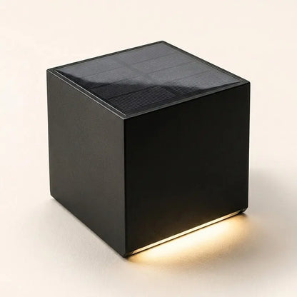 Black cube-shaped solar light on a white background