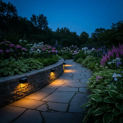 Stone pathway illuminated by lights in a garden at night