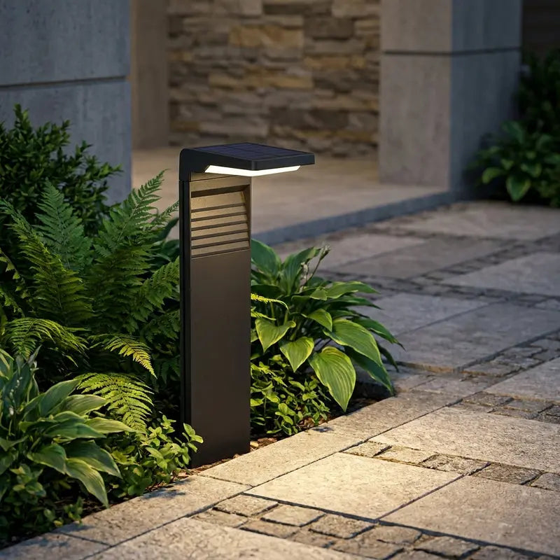 Outdoor garden light fixture on a stone pathway with plants and stone wall background