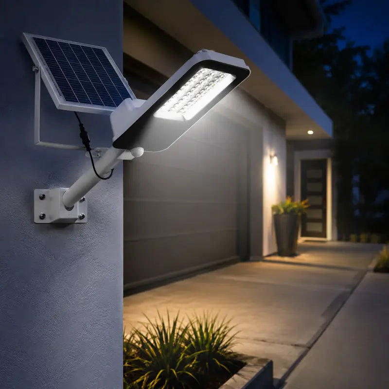 Solar street light on a wall with a building and pathway in the background