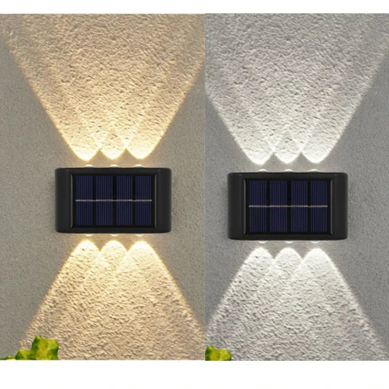 Solar-powered outdoor wall lights on a textured wall with shadows.