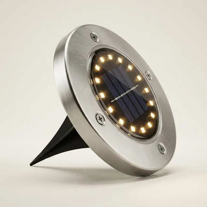 Solar-powered outdoor light with a metallic finish on a neutral background