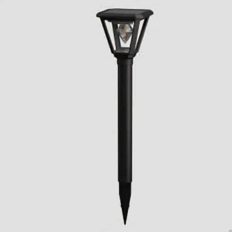 Black outdoor solar lamp on a gray background