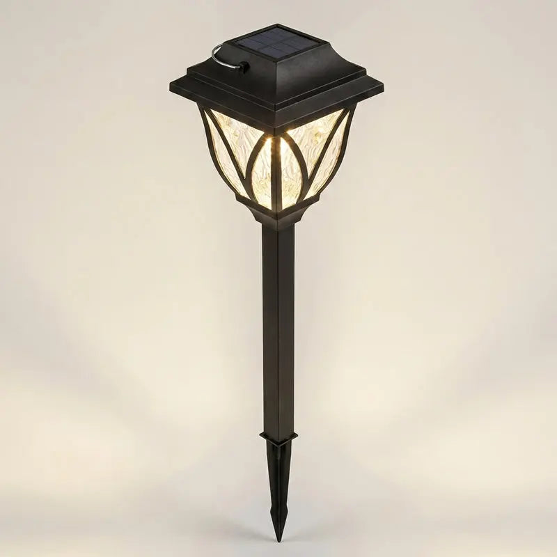Solar-powered garden lamp with a black base on a light gray background