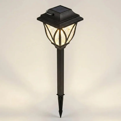 Solar-powered garden lamp with a black base on a light gray background